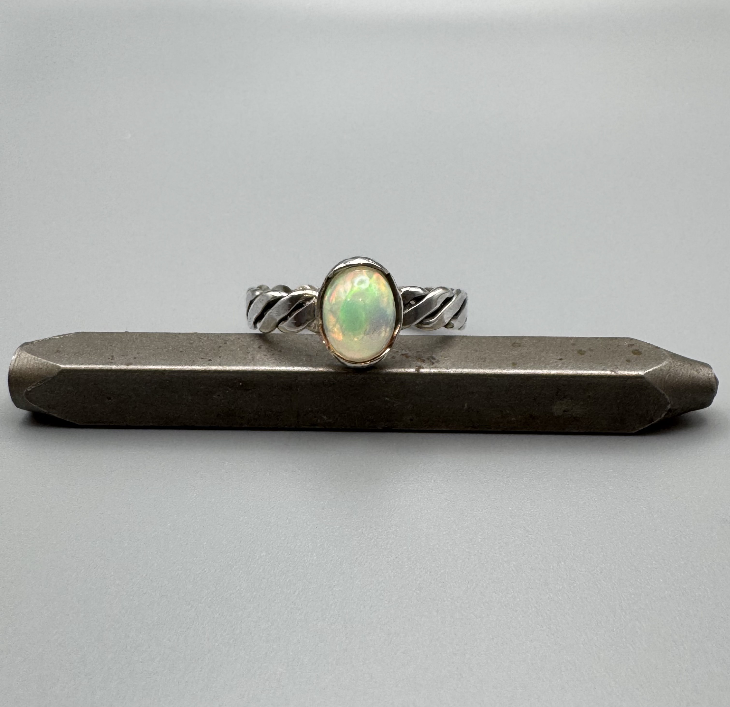 Opal ring with cable band